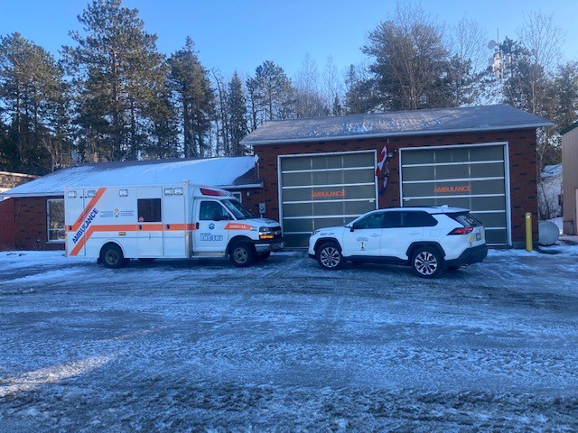 One District of Nipissing ambulance and one Community Paramedic vehicles in front of the Temagami Paramedic Services base. 